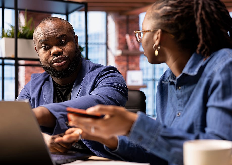A couple discussing their finances. — DC Studio // Shutterstock