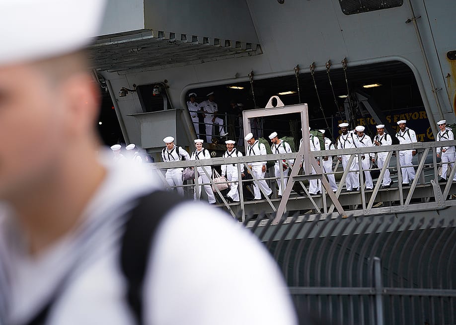 Sailors disembark from the USS Carl Vinson after returning from deployment to their homeport at Naval Air Station North Island in Coronado, California. — Nelvin C. Cepeda // The San Diego Union-Tribune via Getty Images