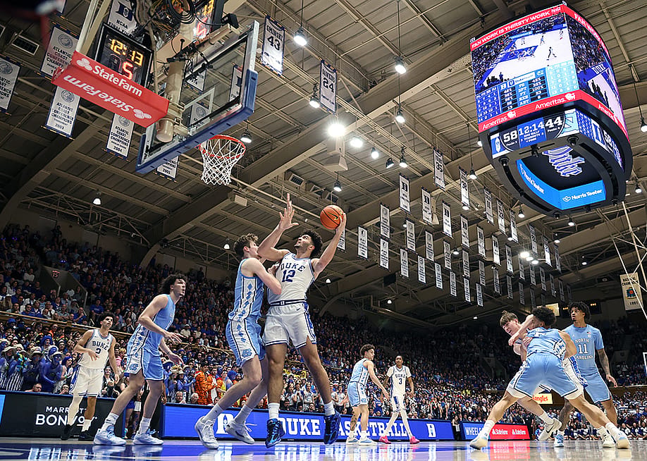 Cameron Boozer #12 of the Duke Blue Devils posts up against Henri Veesaar #13 of the North Carolina Tar Heels during the second half of the game at Cameron Indoor Stadium on March 07, 2026 in Durham, North Carolina. — Jared C. Tilton // Getty Images