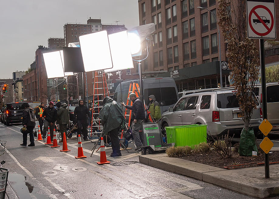Lights and crew men during a filmmaking in Chelsea neighborhood, New York, USA. — rblfmr // Shutterstock