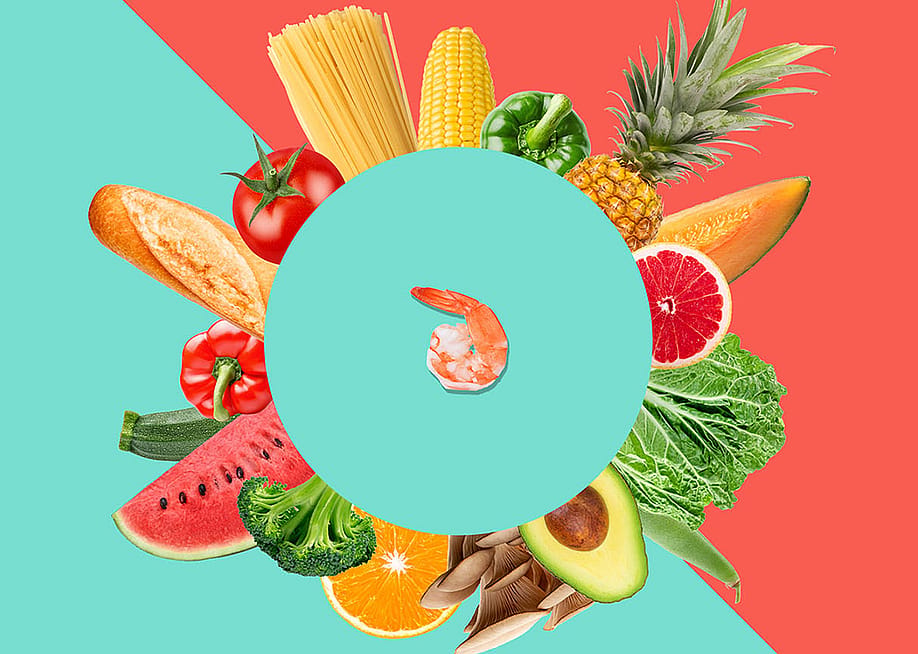 Bread, grains, fruits, and vegetables arranged in a circular pattern around a shrimp at the center. — Knowable Magazine