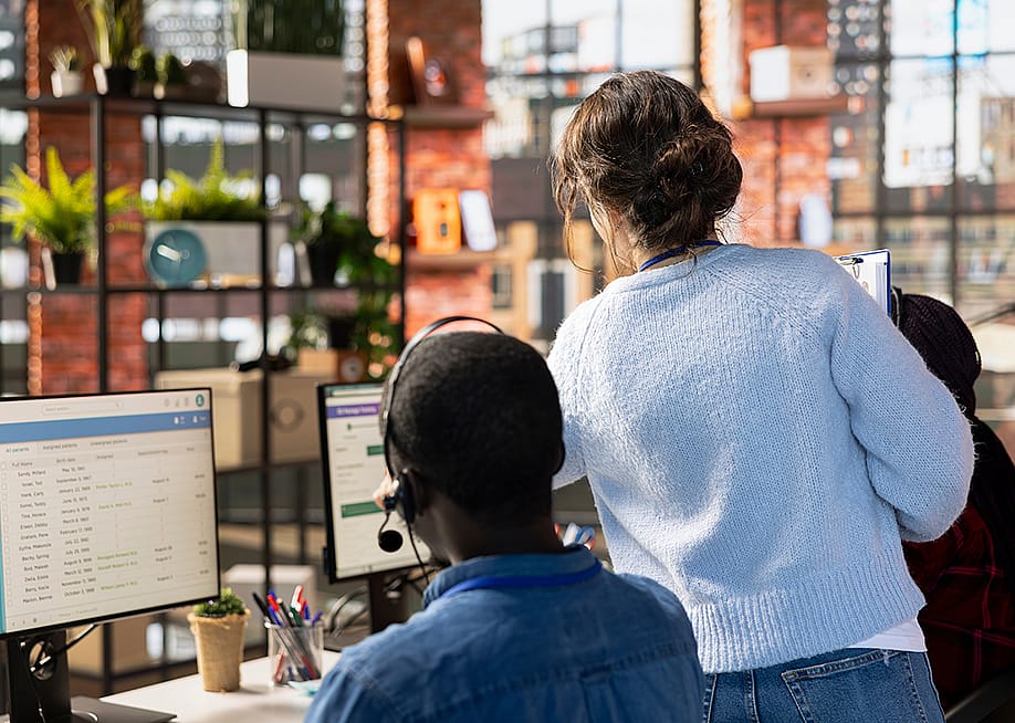 A manager assisting agents during customer calls in a CSM (Customer Service Management) system. — DC Studio // Shutterstock