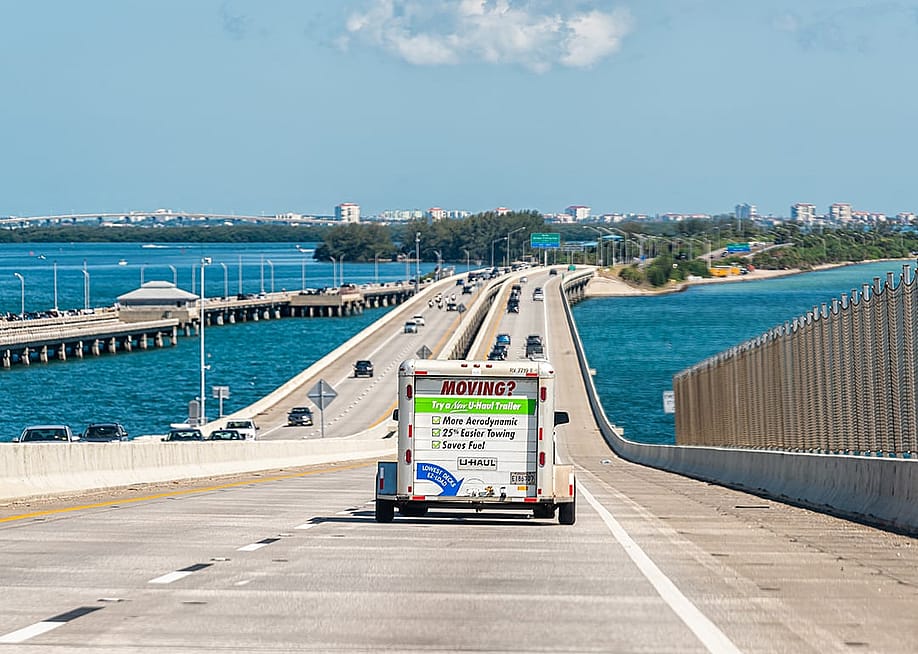 A U-Haul trailer truck crossing the Tampa Bay bridge in Florida. — Kristi Blokhin // Shutterstock