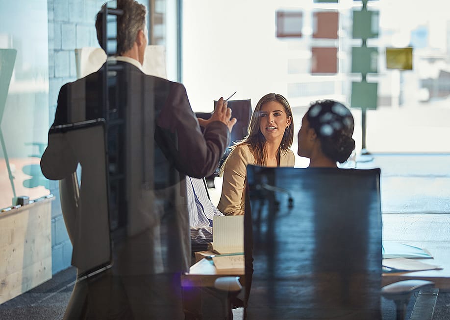 A manager discussing during an office meeting. — PeopleImages // Shutterstock