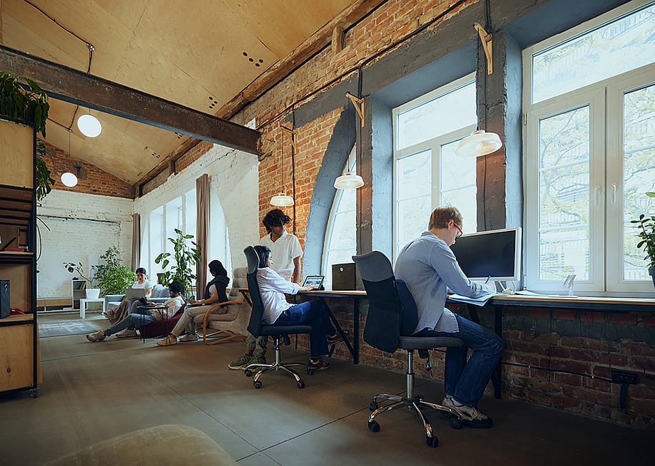 Employees in an interactive co-working space. — Master1305 // Shutterstock