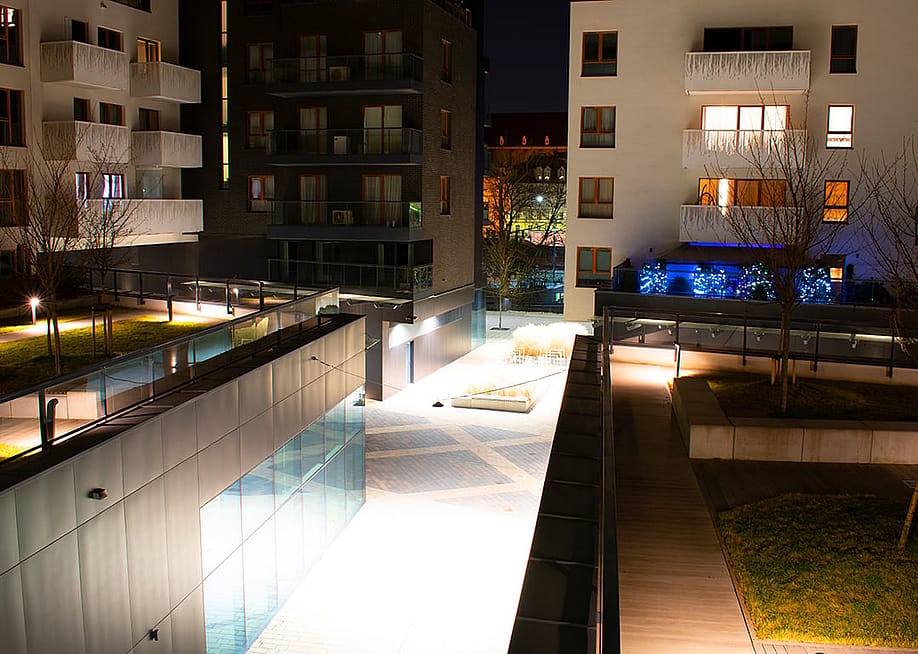 A modern residential complex at night in Wroclaw, Poland. — B.inna // Shutterstock