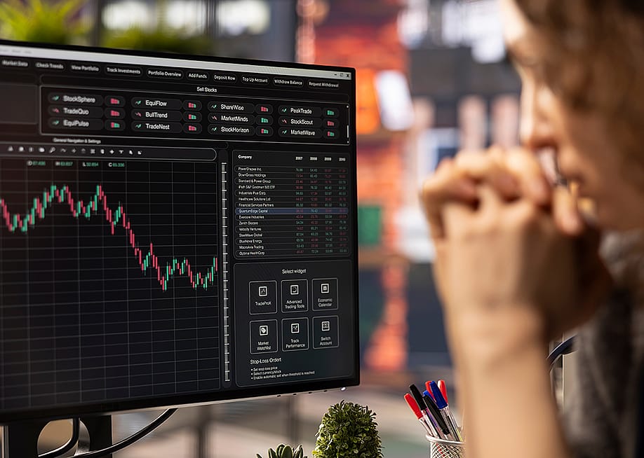 A business person analyzing financial charts using stock market visualization from a laptop. — DC Studio // Shutterstock