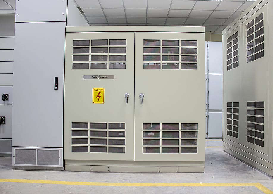A dry type transformer installed in an electrical room from a power plant. — Nutthapat Matphongtavorn // Shutterstock