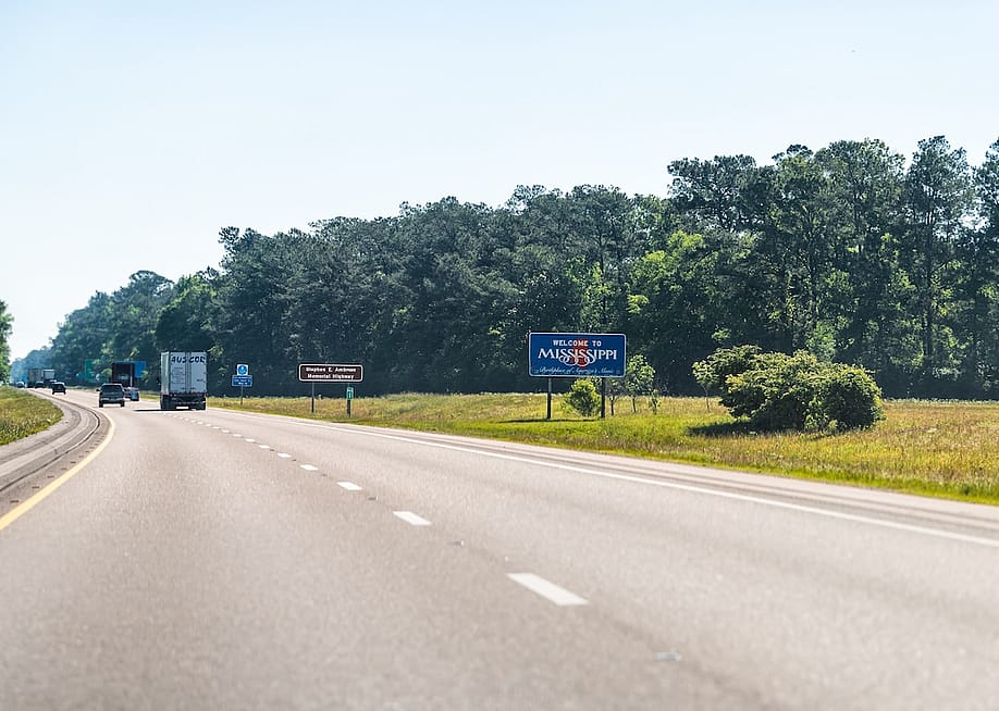 A 'Welcome to Mississippi' road sign on the highway at the border of Louisiana. — Andriy Blokhin // Shutterstock