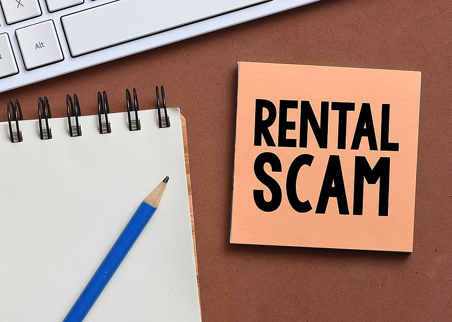 A rental scam text on a note. — Robert Plociennik // Shutterstock