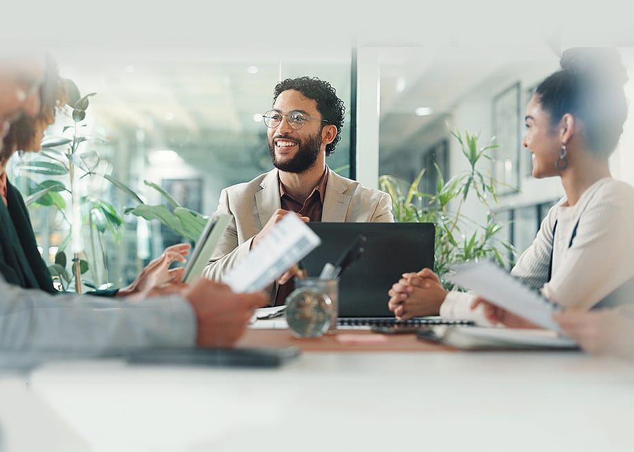 Businessman leading a team meeting. — PeopleImages // Shutterstock
