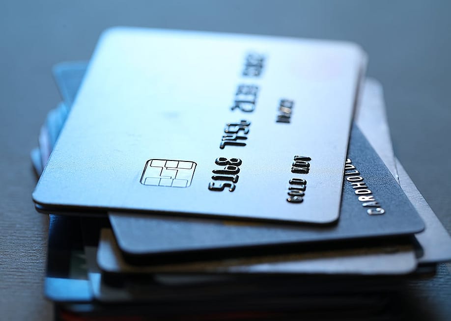 A stack of grey credit cards. — New Africa // Shutterstock