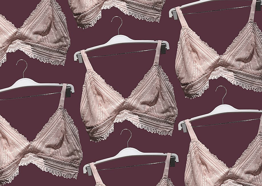 Pink lace unlined bras on a hanger. — Anastasiia Horova // Shutterstock