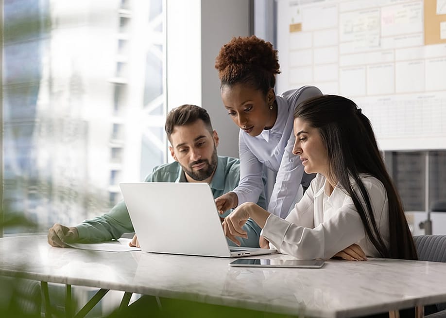A group of work colleagues discussing about business strategies. — fizkes // Shutterstock
