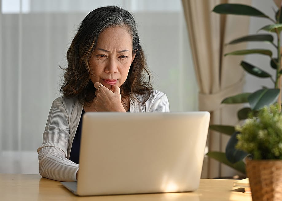 A business person working remotely from home. — Pranithan Chorruangsak // Shutterstock