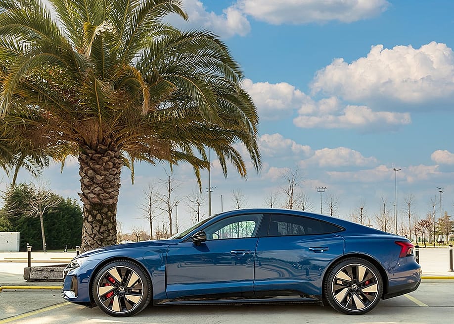 An Audi e-tron GT electric car parked in a road in Istanbul, Turkey. — emirhankaramuk // Shutterstock