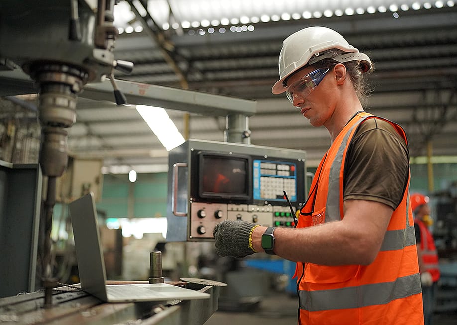 An industrial engineer working inside a manufacturing factory. — Rawpixels stock // Shutterstock