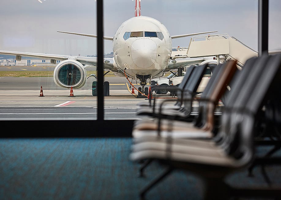 A view of a plane being refueled from the departure area of an airport. — ABB Photo // Shutterstock