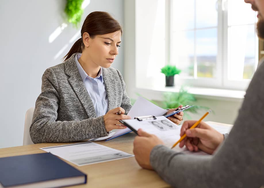 Recruiters review candidates' resumes. — Studio Romantic // Shutterstock