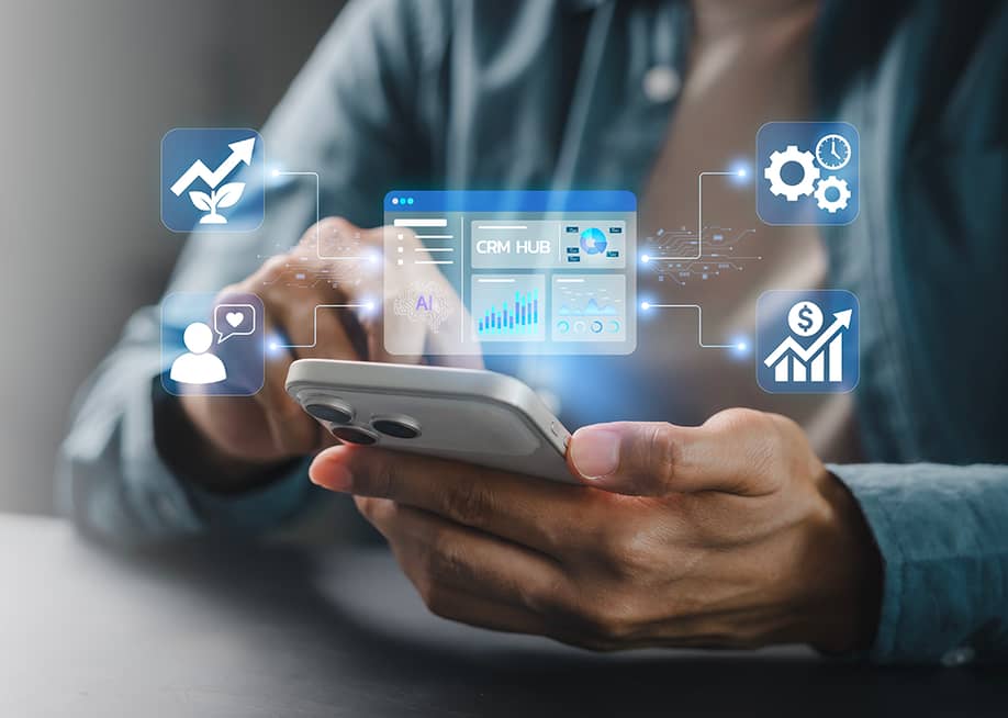 Person using smartphone illustration with CRM system graphics. — HappyEva // Shutterstock