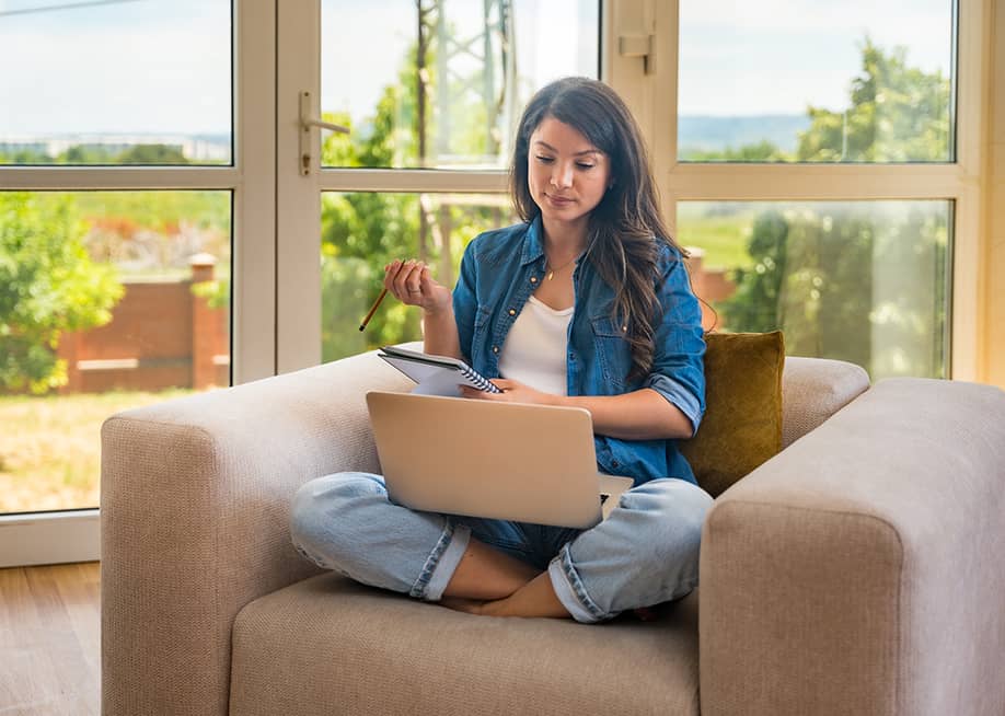 A female therapist working from home. — Srdjan Randjelovic // Shutterstock