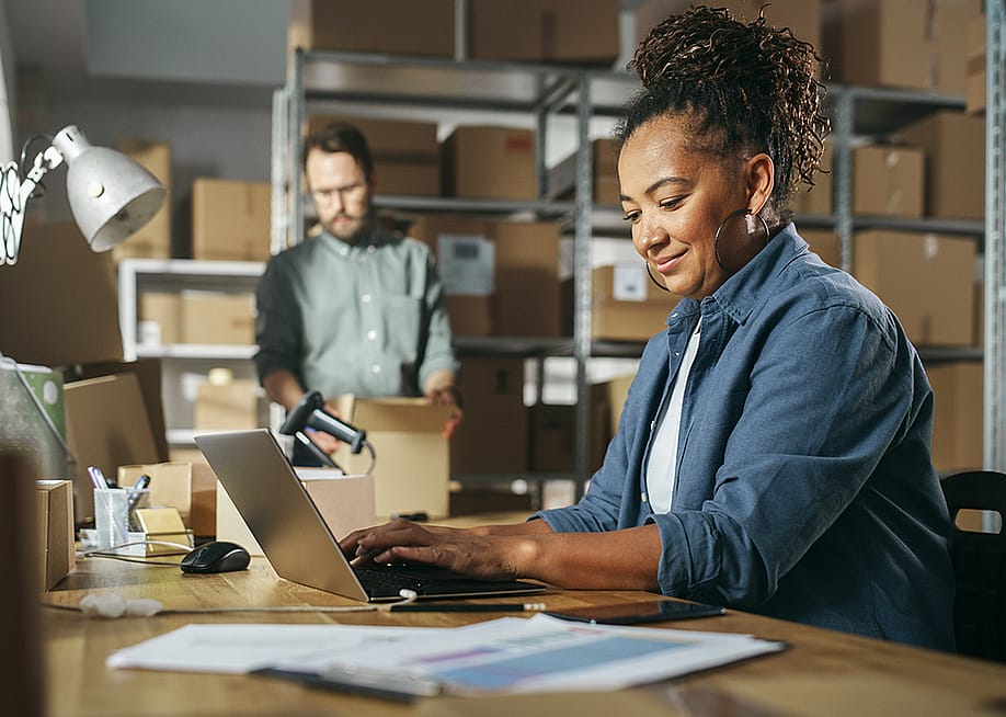 Retail managers check inventory stocks in a warehouse. — Gorodenkoff // Shutterstock