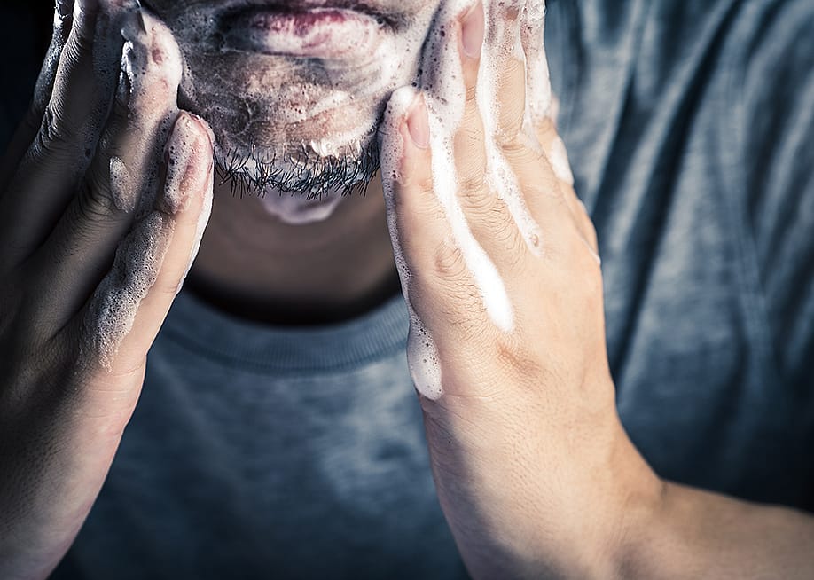 A man washing his face. — beeboys // Shutterstock