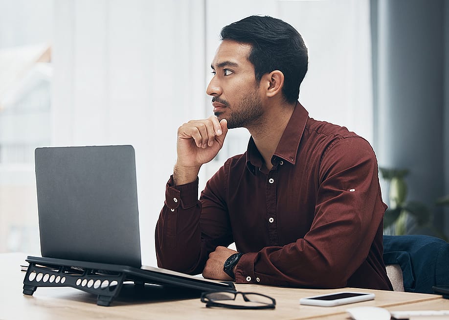 A business employee planning on solutions for a work project in an office.l — PeopleImages // Shutterstock