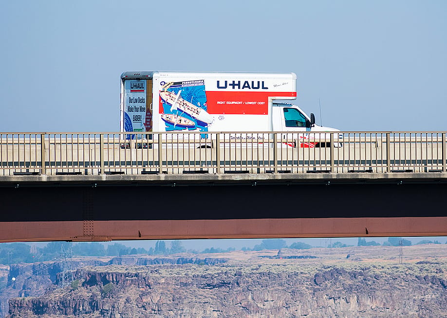 A U-Haul moving truck traveling on Perrine Memorial Bridge in Idaho. — Michael Vi // Shutterstock