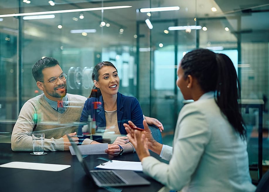 A couple having a consultation with a finance professional. — Drazen Zigic // Shutterstock
