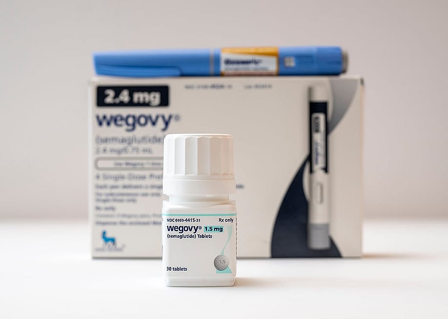 Wegovy semaglutide tablets on a white background with Ozempic and Wegovy injection pens. — Michael Siluk // UCG / Universal Images Group via Getty Images