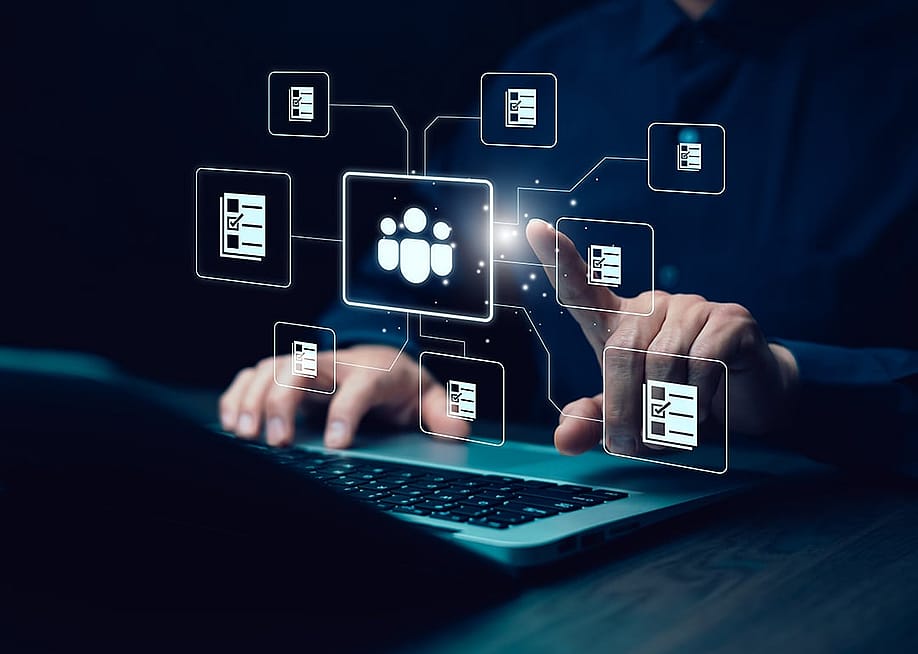 Businessman interacting with a virtual holographic HR system. — R.bussarin // Shutterstock
