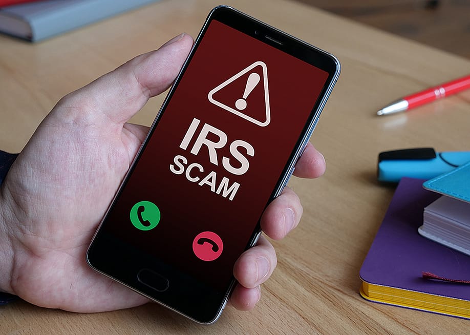 An Internal Revenue Service (IRS) scam call is displayed from a smartphone. — Jack_the_sparow // Shutterstock