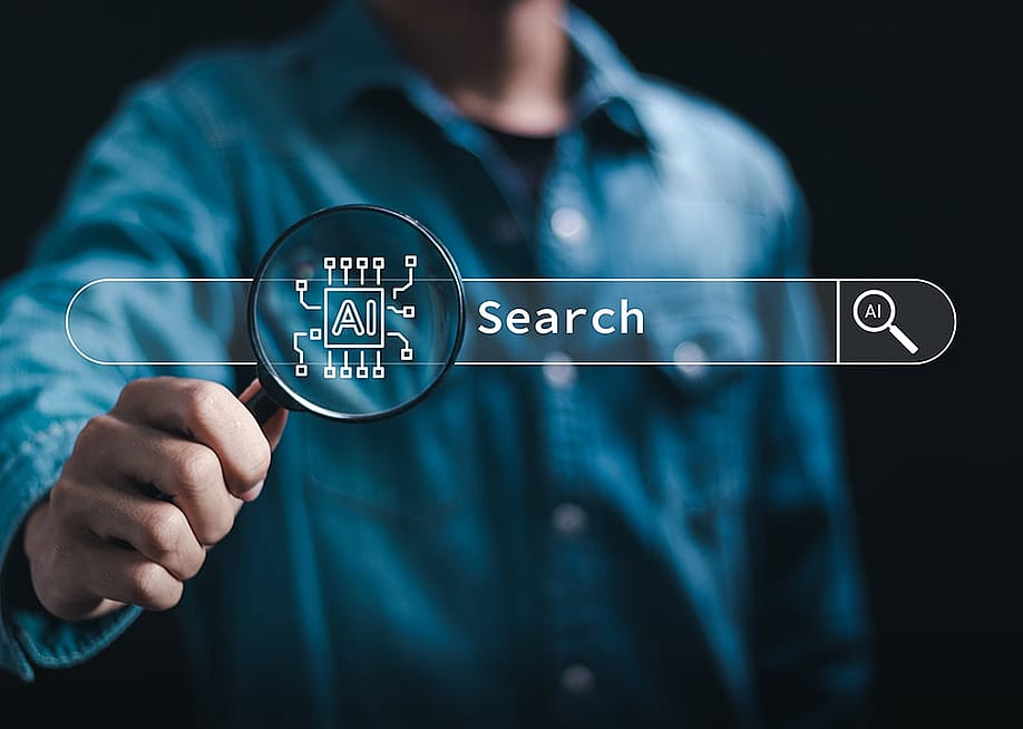 An artificial intelligence (AI) search technology and a data analyst holding a magnifying glass in the background. — A9 STUDIO // Shutterstock