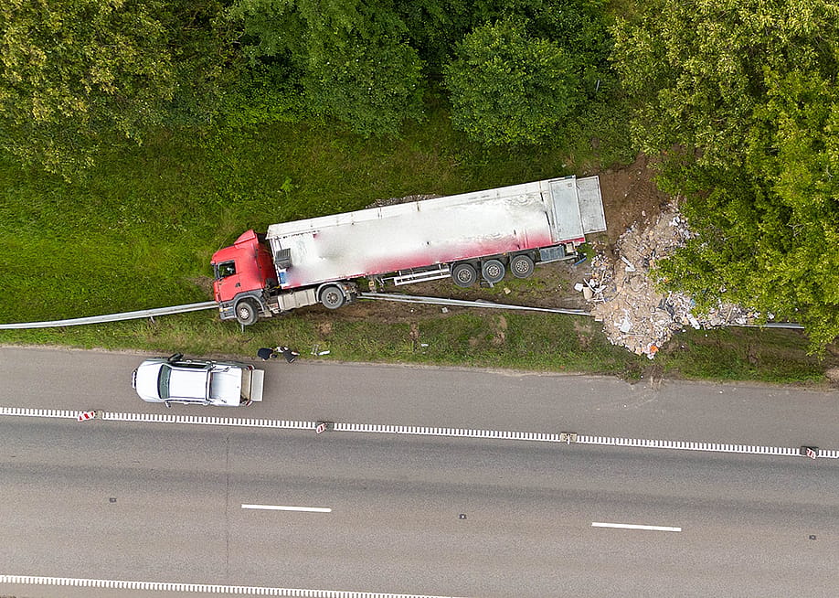 An aerial view of a truck accident scene on a highway. — Mantvis // Shutterstock