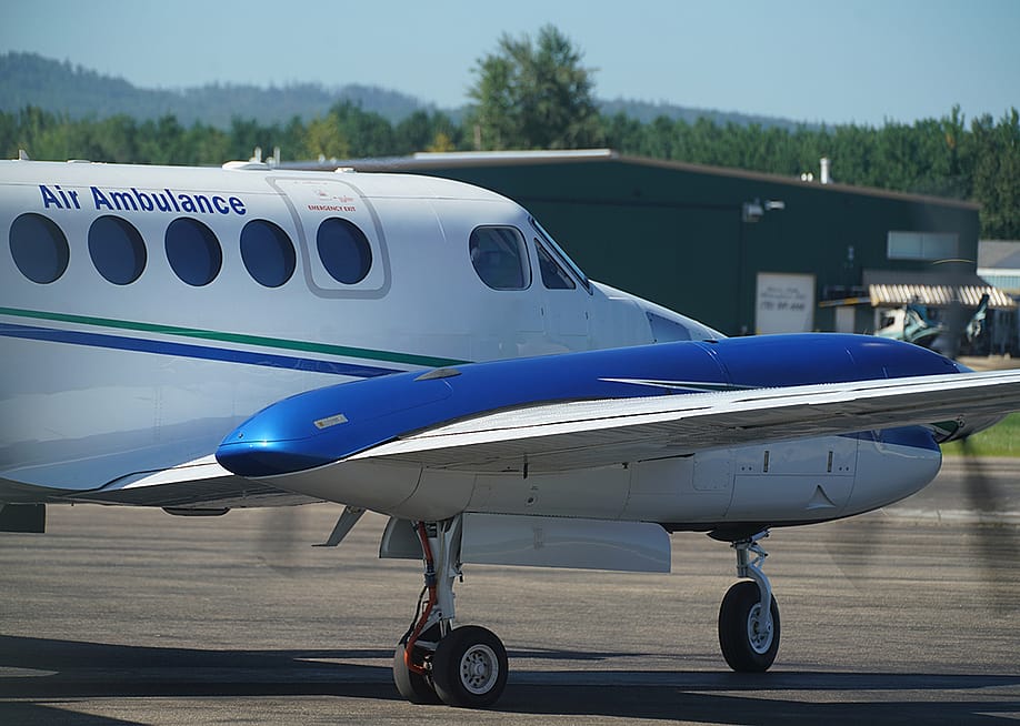 An air ambulance plane in a runway. — Gayleen Froese // Shutterstock