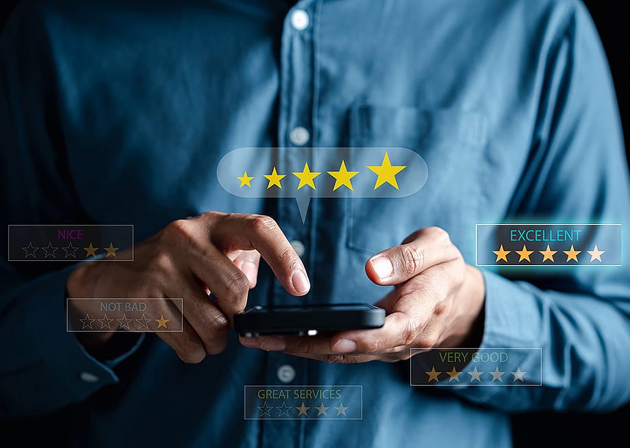 Man using a phone illustrated with graphics depicting rating customer service online. — MMD Creative // Shutterstock
