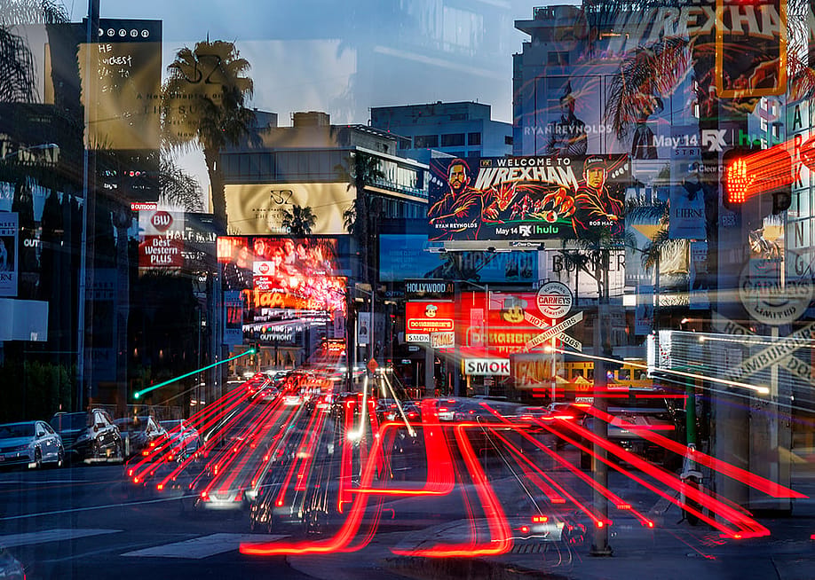 A slow exposure shot resulting in a mosaic of streaming car lights in a sea of billboards on Sunset Boulevard in West Hollywood. — Gina Ferazzi // Los Angeles Times via Getty Images