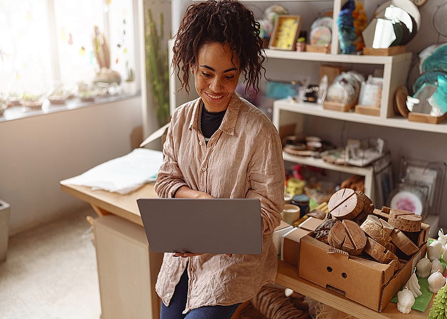 A decorator checking work online in her own art studio. — Kostiantyn Voitenko // Shutterstock