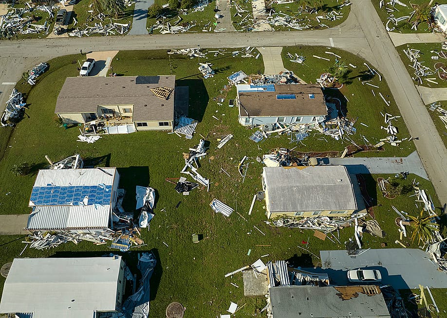 Aerial view of a residential area heavily damaged by hurricane Ian in Florida. — Bilanol // Shutterstock