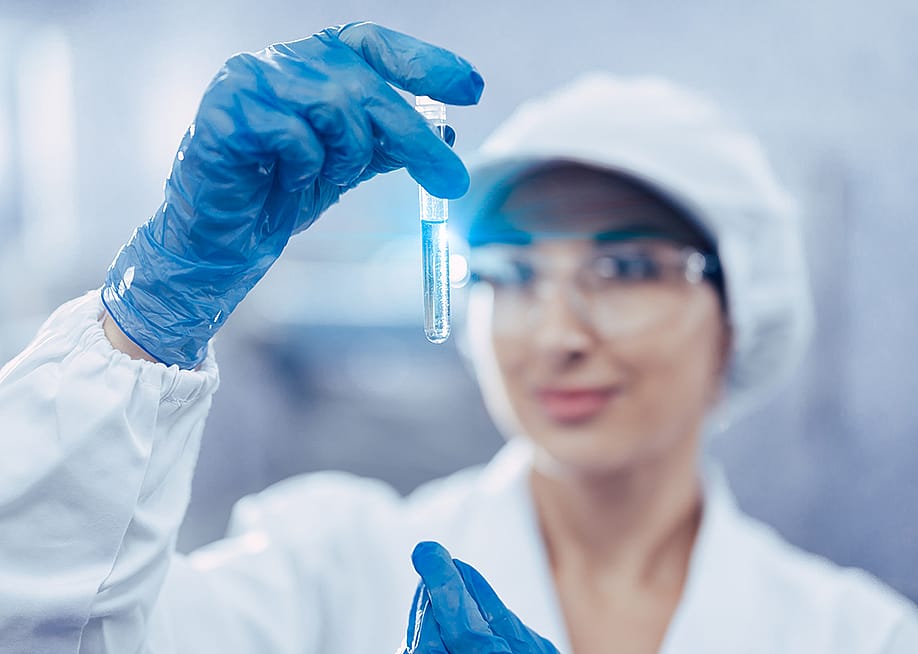 A female scientist checking water quality from a sample. — Quality Stock Arts // Shutterstock