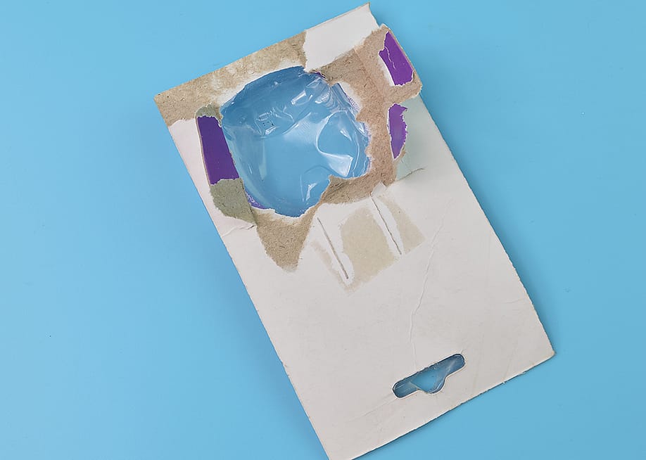 A torn cardboard and plastic packaging. — Teacher Photo // Shutterstock