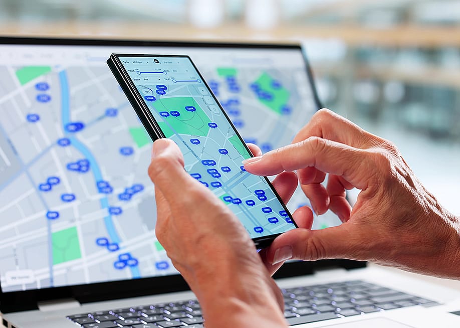 A user tracks property listing in an area using maps. — Andrey_Popov // Shutterstock