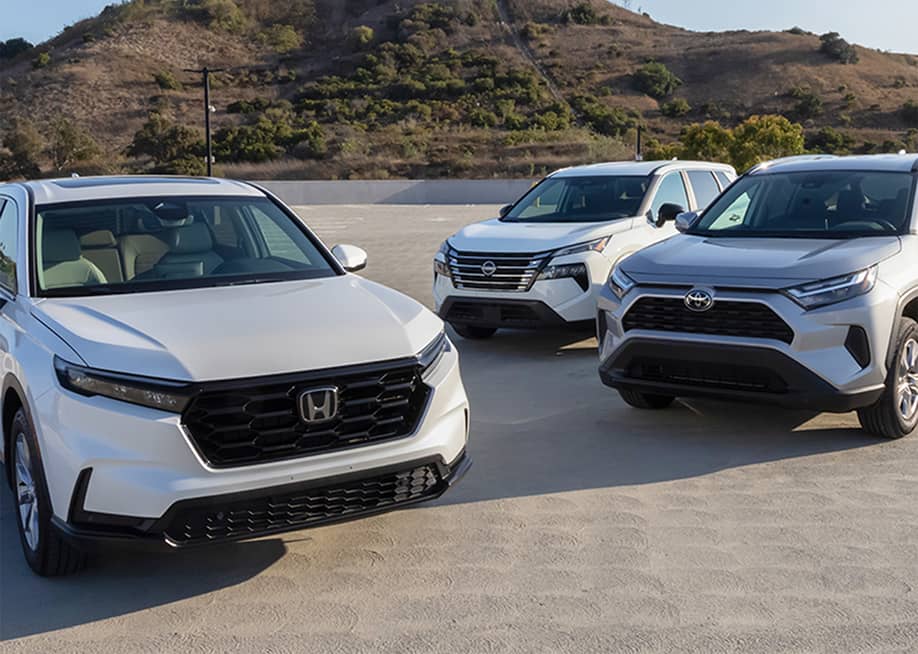 onda CR-V, Toyota RAV4, and Nissan Rogue cars on a wide lot. — Courtesy of CarMax