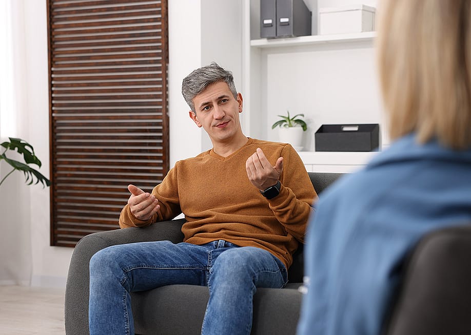 A professional psychologist during a session with a patient in a clinic. — New Africa // Shutterstock