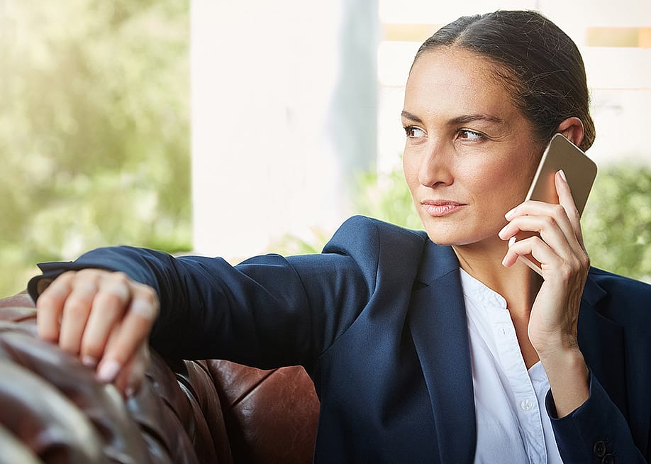 A businesswoman in a sales call. — PeopleImages // Shutterstock