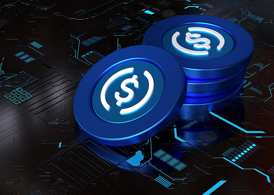 A 3D rendering of a stack of stablecoins on top of a computer circuit system. — ddRender // Shutterstock