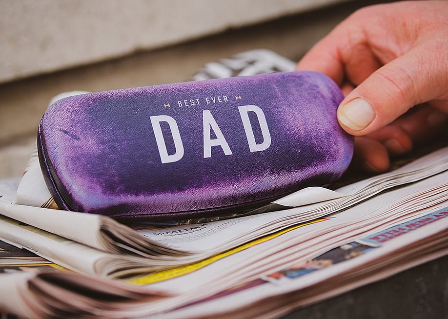 A velvet-covered eyeglasses case with a "Best Ever Dad" inscription. — Aamir Ayaan // Shutterstock