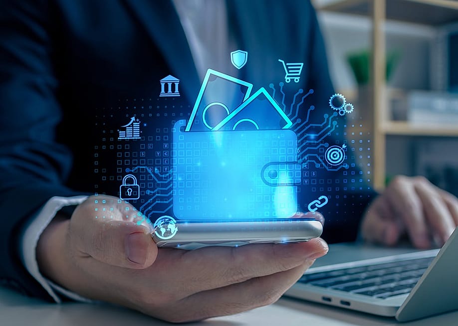 Digital wallet graphics over a businessman using a phone as a concept of digital banking. — TStudious // Shutterstock