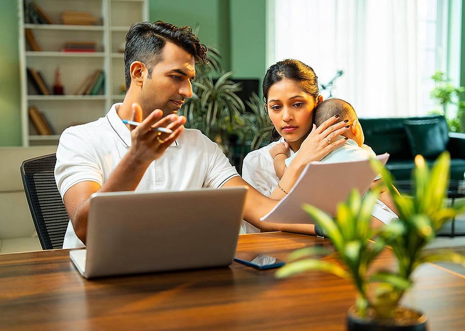 A married couple discussing about family matters and budget at home. — StockImageFactory.com // Shutterstock